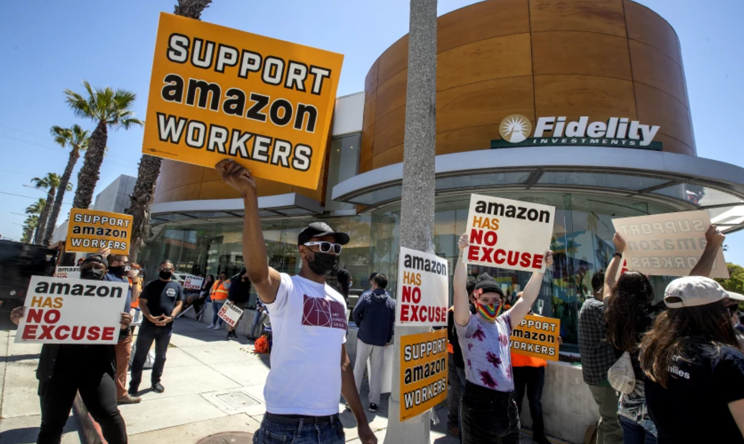 Union activists and other supporters of Amazon workers protested in May outside Fidelity Investments, one of Amazon’s largest shareholders, in Santa Monica. Activists want Amazon to be more accountable to workers, who too frequently get injured on the job. (Mel Melcon / Los Angeles Times)