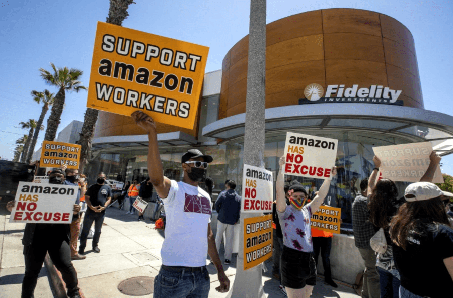 Union activists and other supporters of Amazon workers protested in May outside Fidelity Investments, one of Amazon’s largest shareholders, in Santa Monica. Activists want Amazon to be more accountable to workers, who too frequently get injured on the job. (Mel Melcon / Los Angeles Times)