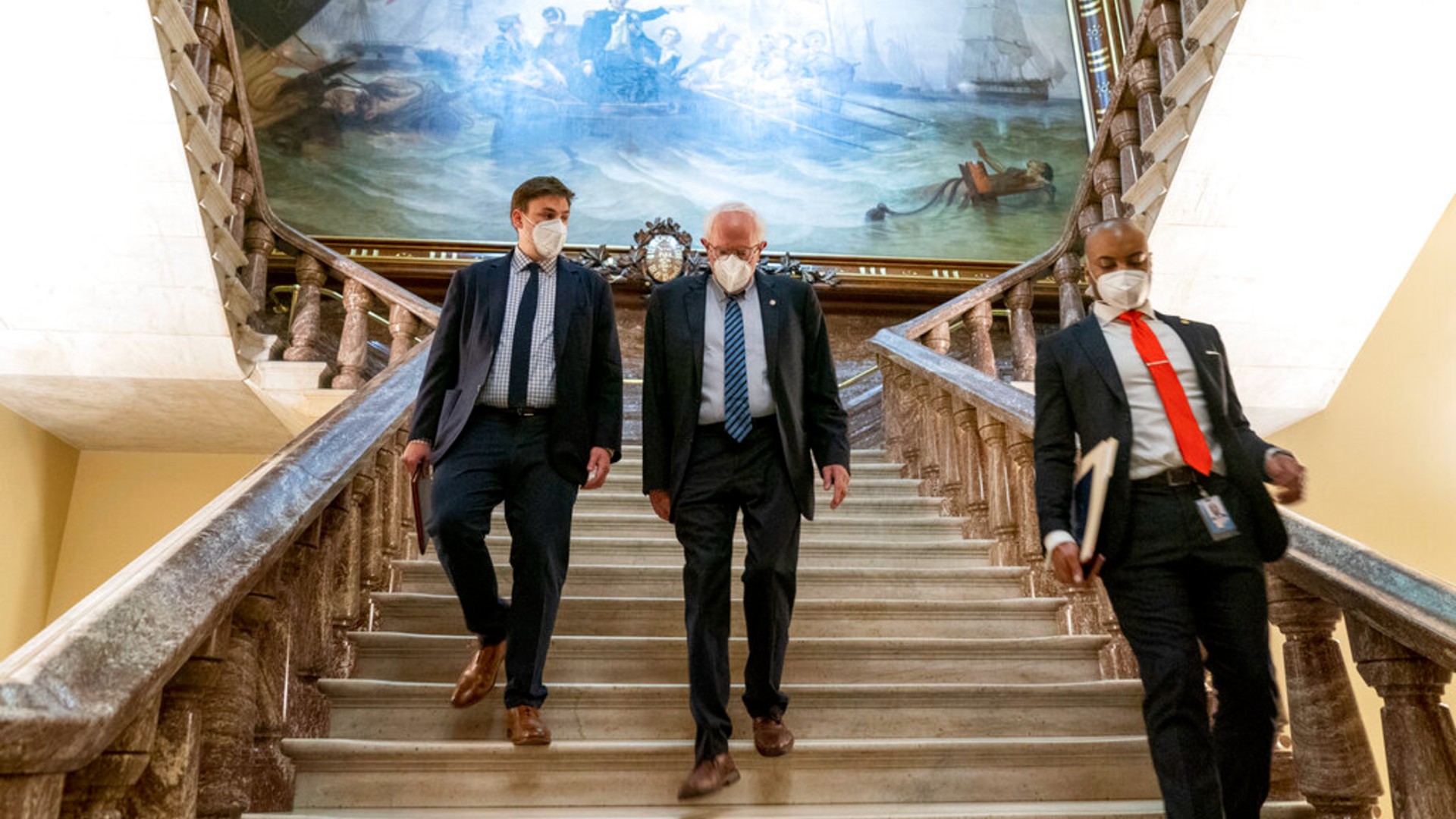 Senate Budget Committee Chairman Bernie Sanders, I-Vt., center, walks towards the Senate floor at the Capitol in Washington, Tuesday, Aug. 10, 2021. (AP Photo/Andrew Harnik)