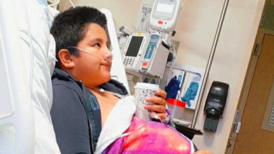 This 2021 photo provided by Yessica Gonzalez shows her son, Francisco Rosales, 9, in the intensive care unit at Children’s Medical Center in Dallas, Texas. The day before he was supposed to start fourth grade, Francisco was admitted to the hospital due to severe COVID-19, struggling to breathe, with dangerously low oxygen levels and an uncertain outcome. (Yessica Gonzalez via AP)