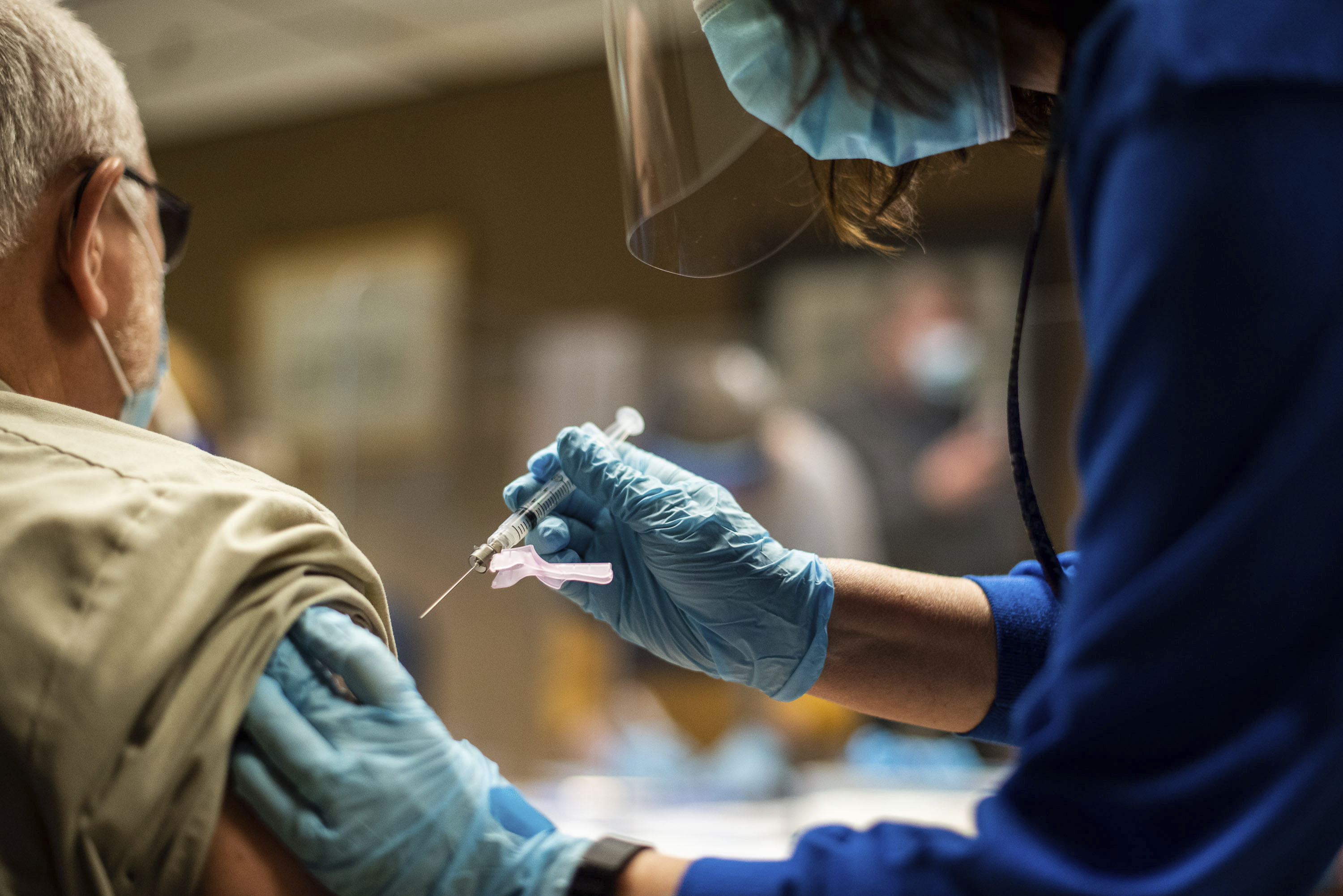 In this Feb. 2, 2021, file photo, Tyson Foods team members receive COVID-19 vaccines from health officials at the Wilkesboro, N.C. facility. (Melissa Melvin/AP Images for Tyson Foods File)