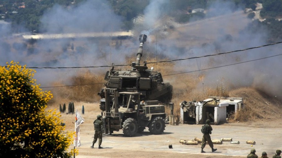 Israeli self-propelled howitzers fire towards Lebanon from the northern Israeli town of Kiryat Shmona following rocket fire from the Lebanese side of the border, on August 4, 2021. (JALAA MAREY/AFP via Getty Images)