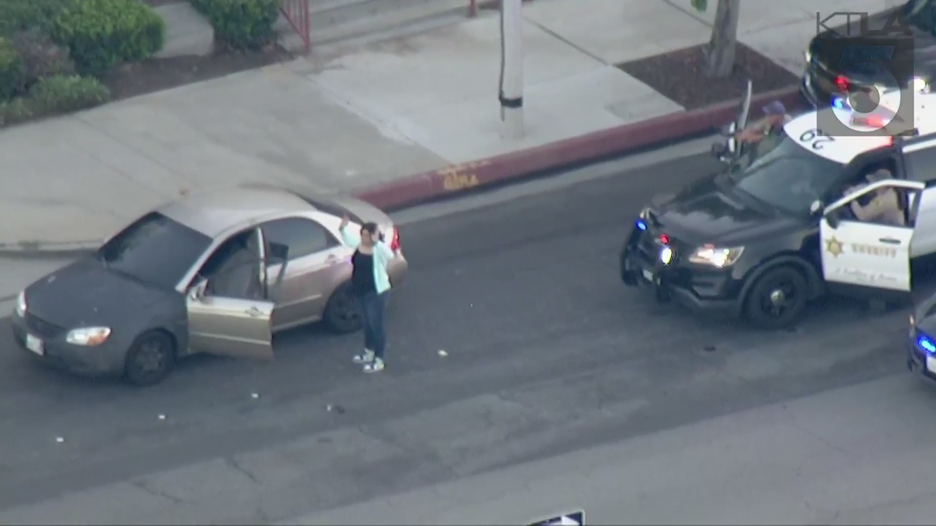 A driver surrenders to authorities following a pursuit in the Azusa area on Aug. 3, 2021. (KTLA)