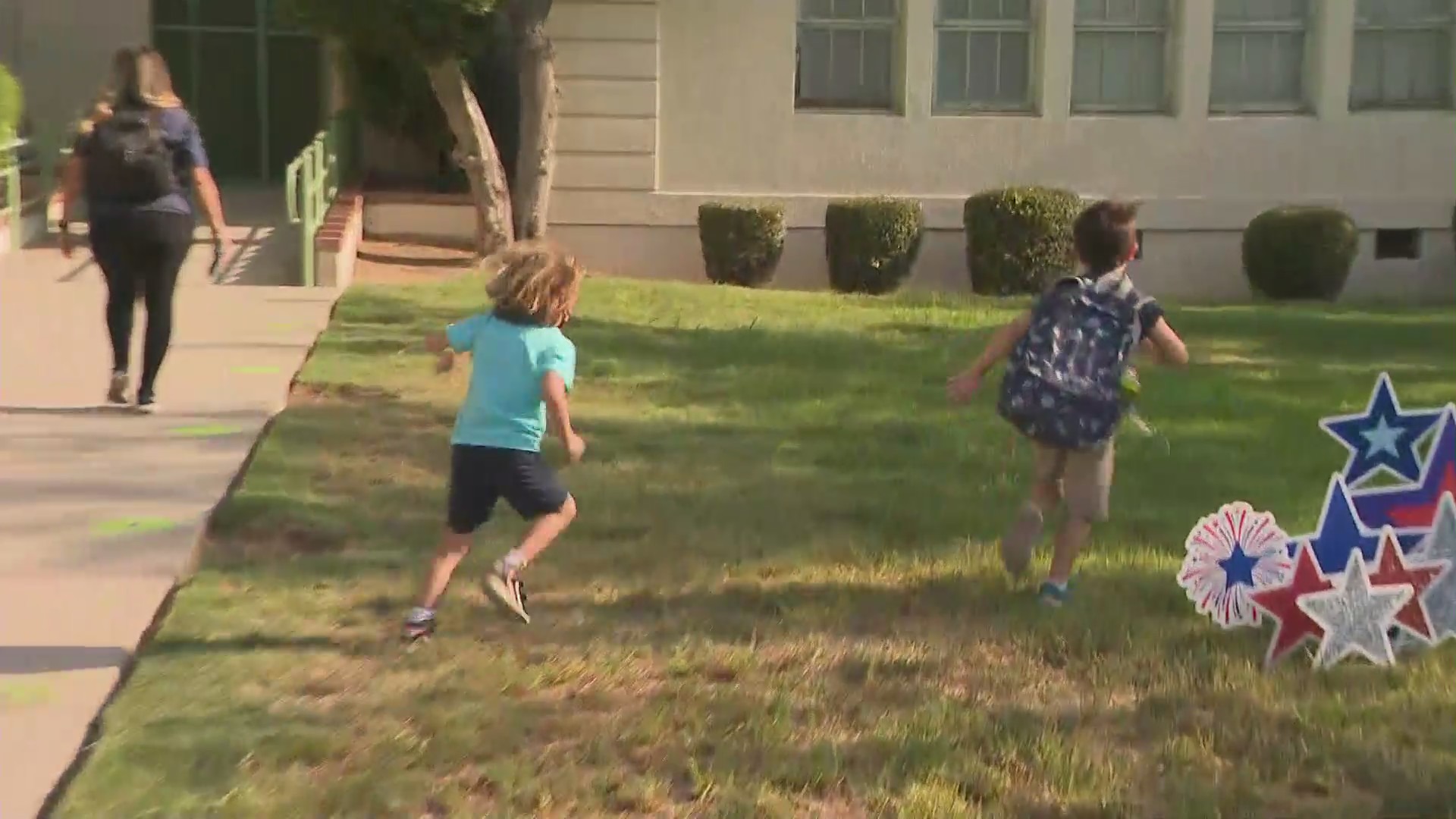 Children run to school on the first day back in Pasadena on Aug. 12, 2021. (KTLA)