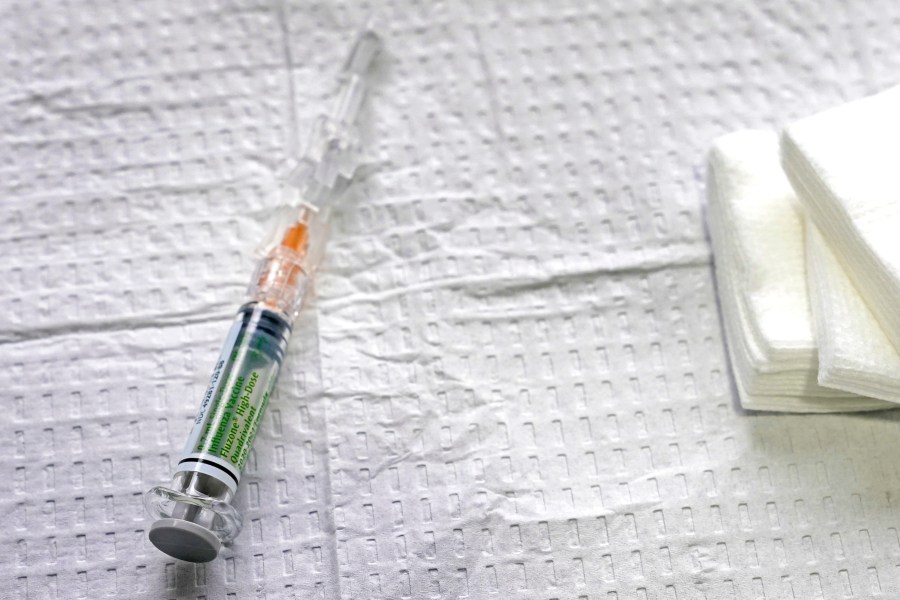 A syringe of high-dose flu vaccine typically given to people over the age of 65 is shown on Oct. 15, 2020. (AP Photo/Ted S. Warren)