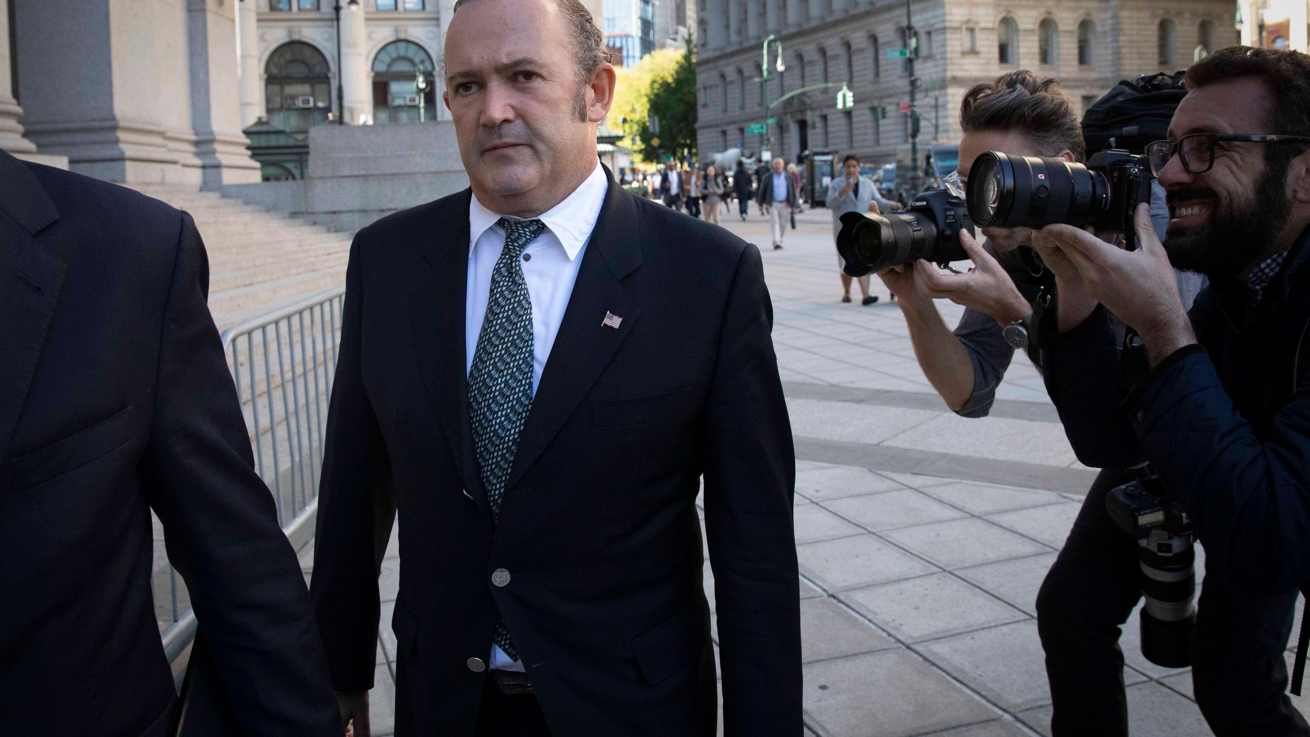 In this Oct. 23, 2019 file photo, Igor Fruman, left, arrives for his arraignment in New York. U.S. (AP Photo/Mark Lennihan, File)