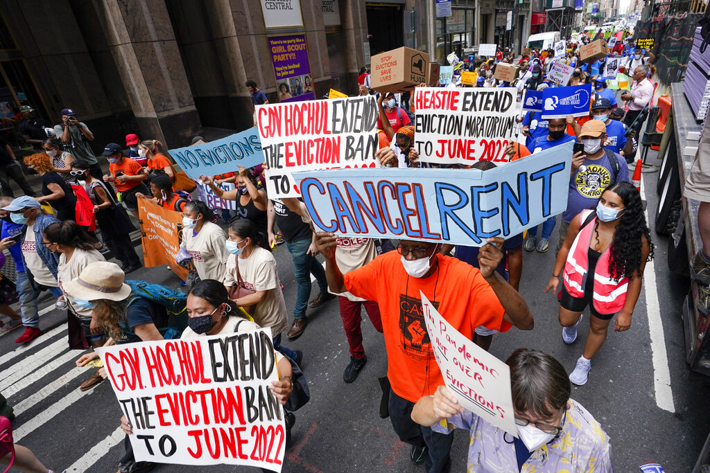 Activist march across town towards New York Gov. Kathy Hochul office, Tuesday, Aug. 31, 2021, in New York, during a demonstration to call on Hochul, Speaker Carl Heastie, and Senate Majority Leader Andrea Stewart-Cousin to extend pandemic era eviction protections in wake of Supreme Court decision lifting the moratorium. (AP Photo/Mary Altaffer)