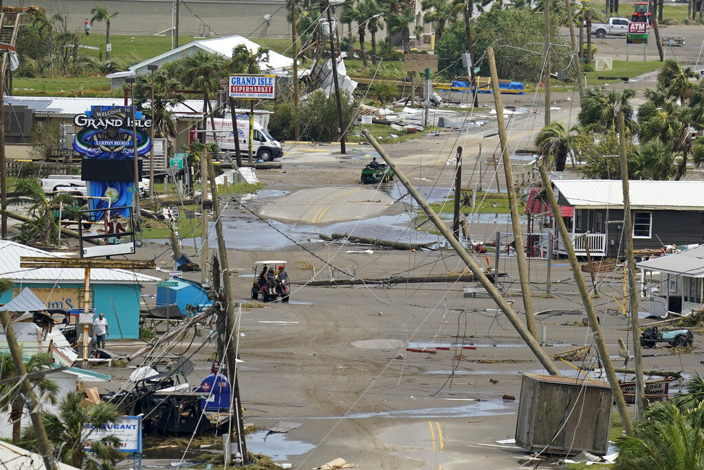 The remains of destroyed homes and businesses are seen in the aftermath of Hurricane Ida in Grand Isle, La., Tuesday, Aug. 31, 2021. (AP Photo/Gerald Herbert)