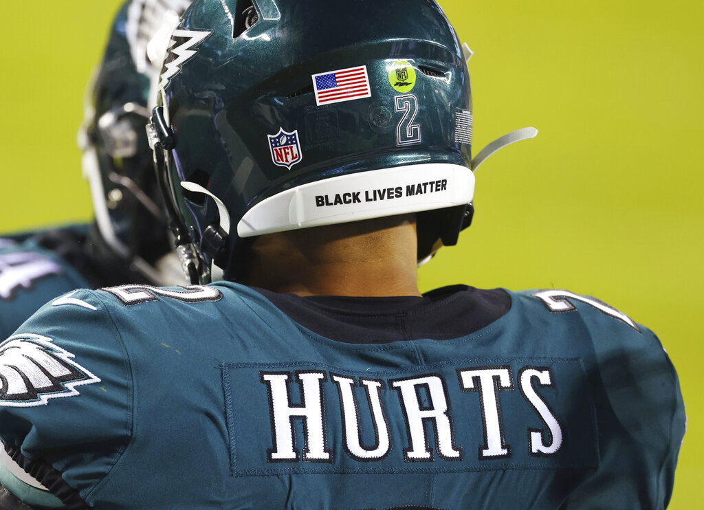 In this Jan. 3, 2021, file photo, Philadelphia Eagles Jalen Hurts wears a Black Lives Matter decal on the back of his helmet during the team's NFL football game against the Washington Football Team in Philadelphia. (AP Photo/Rich Schultz, File)