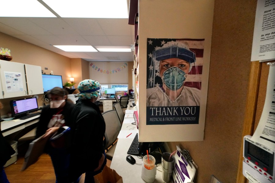 In this Aug. 18, 2021, file photo, a poster honoring medical and frontline workers, hangs on a nursing station of an intensive care unit, at the Willis-Knighton Medical Center in Shreveport, La. (AP Photo/Gerald Herbert, File)