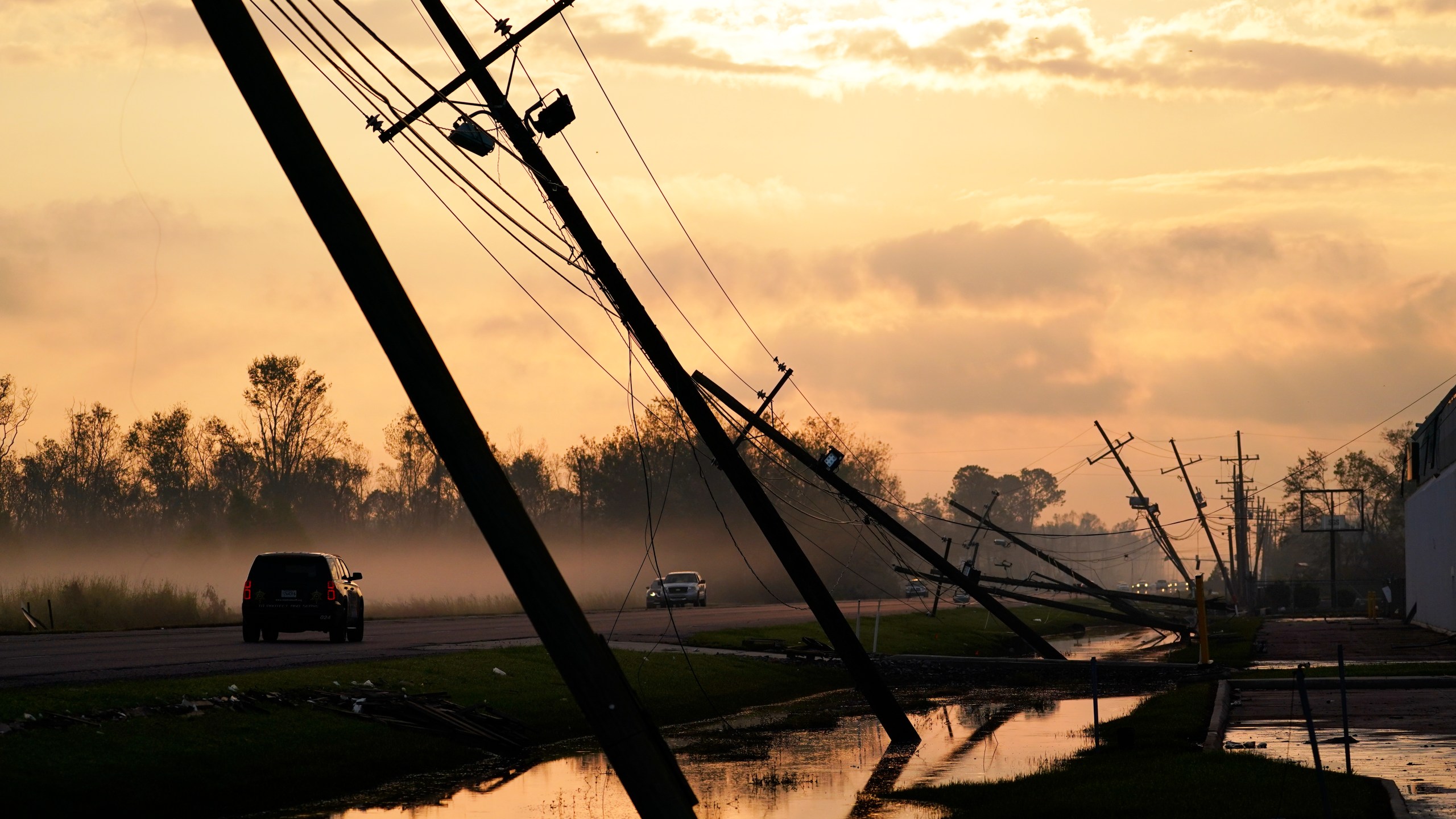 Downed power lines slump over a road in the aftermath of Hurricane Ida Sept. 3, 2021, in Reserve, Louisiana. (Matt Slocum/Associated Press)