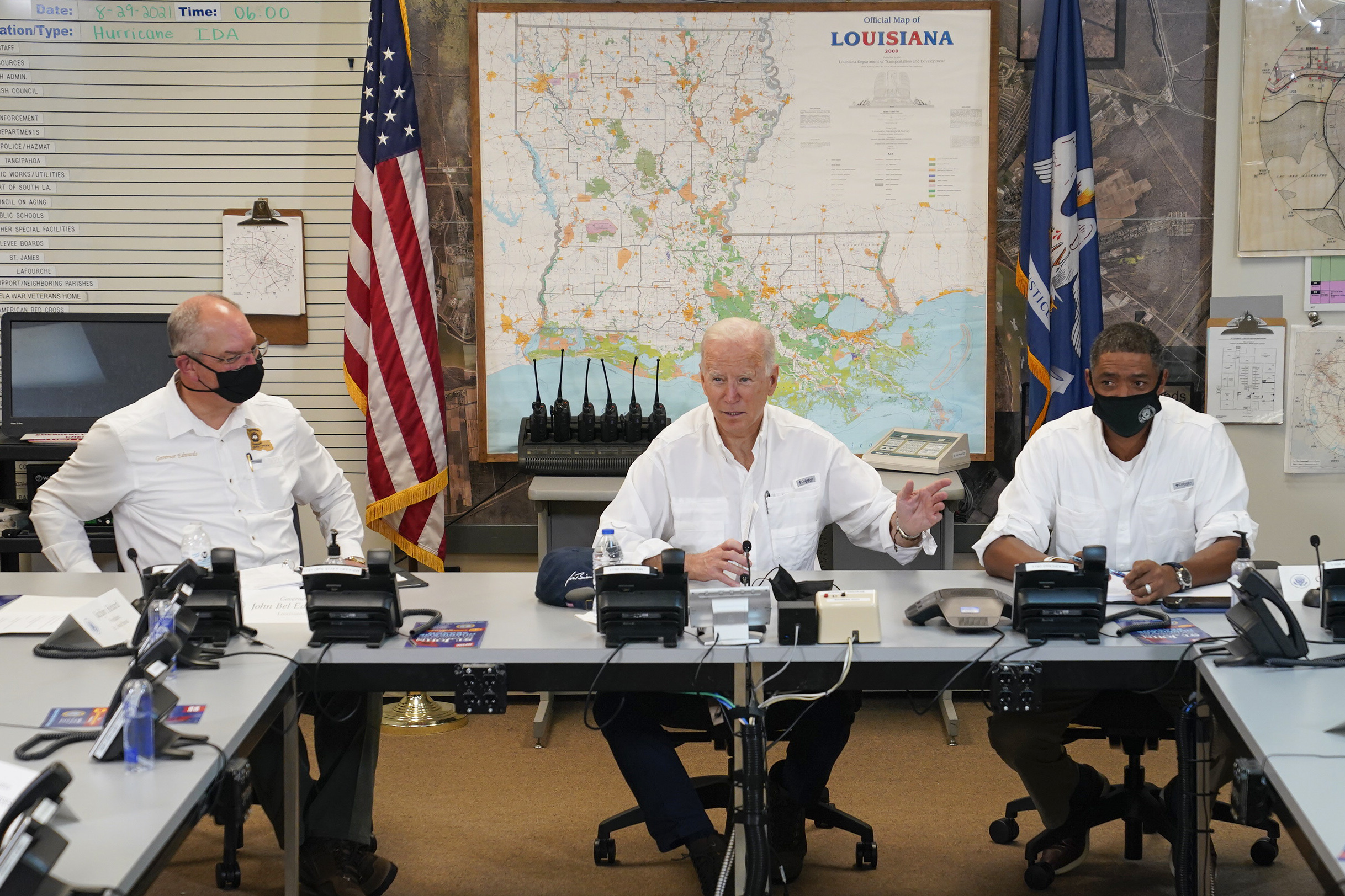 President Joe Biden participates in a briefing about the response to damage caused by Hurricane Ida, at the St. John Parish Emergency Operations Center on Sept. 3, 2021, in LaPlace, La., as Louisiana Gov. John Bel Edwards, left, and White House senior adviser Cedric Richmond listen. (Evan Vucci/Associated Press)