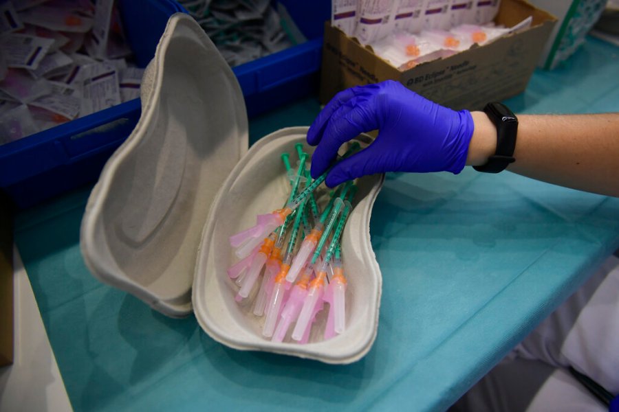 In this Thursday, Sept. 2, 2021 file photo, a health worker prepares Pfizer vaccines during the national COVID-19 vaccination campaign in Pamplona, northern Spain. (AP Photo/Alvaro Barrientos, File)