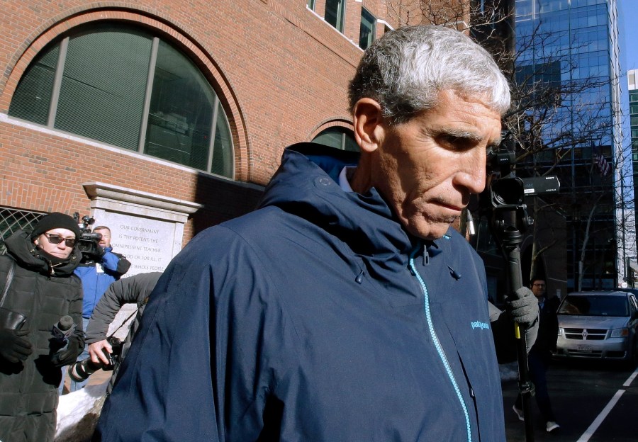 In this March 12, 2019 file photo, William "Rick" Singer founder of the Edge College & Career Network, departs federal court in Boston, after he pleaded guilty to charges in a nationwide college admissions bribery scandal. The first trial in the "Operation Varsity Blues" college admissions bribery scandal will begin this week, Wednesday, Sept. 8, 2021 with the potential to shed light on investigators' tactics and brighten the spotlight on a secretive school selection process many have long complained is rigged to favor the rich. (AP Photo/Steven Senne, File)