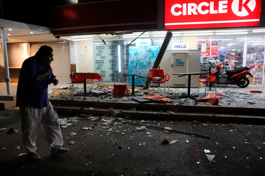 A man walks in from of a convenience store on a street covered with debris after a strong earthquake, in Acapulco, Mexico, Tuesday, Sept. 7, 2021. The quake struck southern Mexico near the resort of Acapulco, causing buildings to rock and sway in Mexico City nearly 200 miles away. (AP Photo/ Bernardino Hernandez)