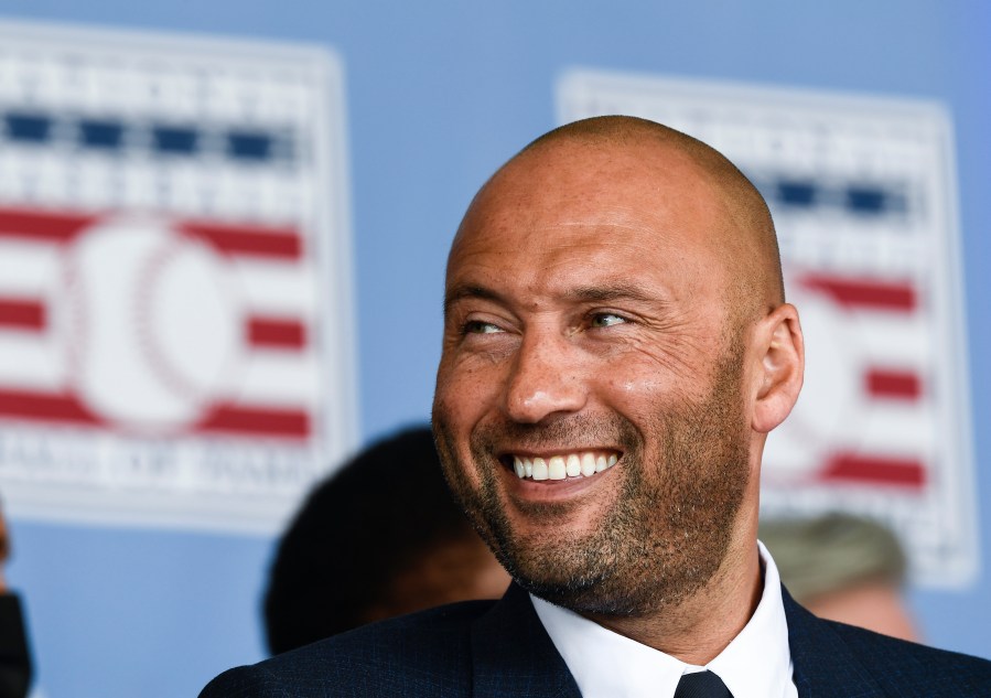 Hall of Fame inductee Derek Jeter, of the New York Yankees, watches a video during an induction ceremony at the Clark Sports Center at the National Baseball Hall of Fame in Cooperstown, N.Y. on Sept. 8, 2021. (Hans Pennink/Associated Press)