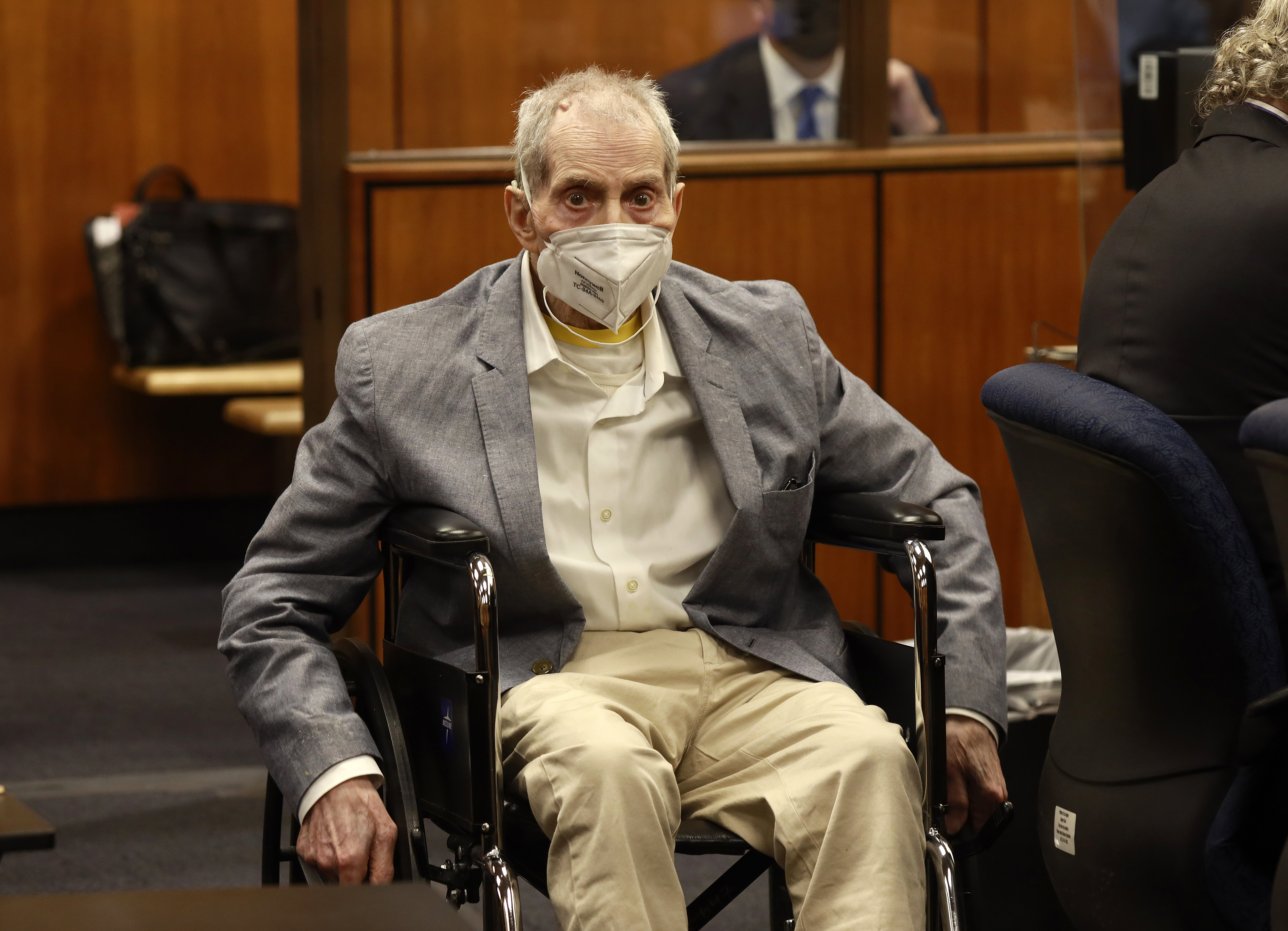 Robert Durst in his wheelchair spins in place as he looks at people in the courtroom in Inglewood, Calif. on Sept. 8, 2021, with his attorneys for closing arguments presented by the prosecution. (Al Seib/Los Angeles Times via AP, Pool)