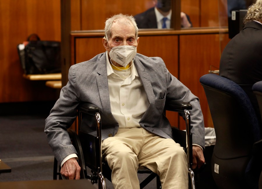 Robert Durst in his wheelchair spins in place as he looks at people in the courtroom in Inglewood, Calif. on Sept. 8, 2021, with his attorneys for closing arguments presented by the prosecution. (Al Seib/Los Angeles Times via AP, Pool)