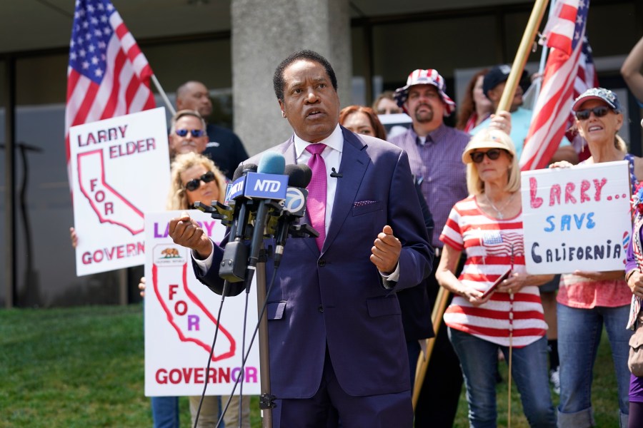 In this July 14, 2021, file photo, gubernatorial candidate and radio talk show host Larry Elder speaks to supporters during a campaign stop in Norwalk, Calif. In two short months, Larry Elder emerged from the province of conservative talk radio to dominate the Republican field in the California recall election that could remove Democratic Gov. Gavin Newsom from office, drawing national headlines, attracting fervent crowds to his rallies and quickly banking millions of dollars for his first campaign. (AP Photo/Marcio Jose Sanchez, File)