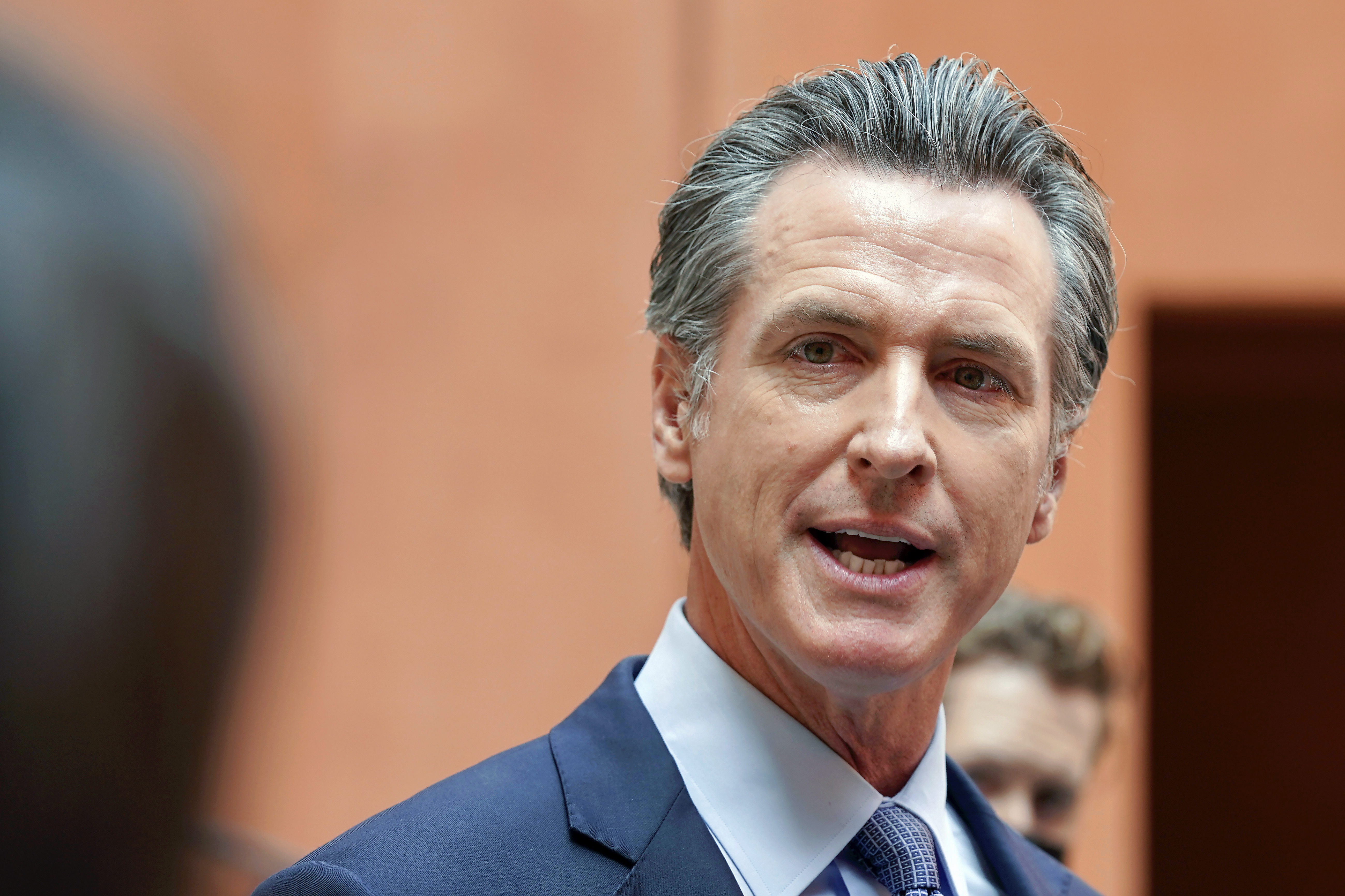 In this Sept. 10, 2021, file photo California Gov. Gavin Newsom responds to a question while meeting with reporters after casting his recall ballot at a voting center in Sacramento, Calif. The last day to vote in the recall election is Tuesday Sept. 14. A majority of voters must mark "no" on the recall to keep Newsom in office. (AP Photo/Rich Pedroncelli, File)