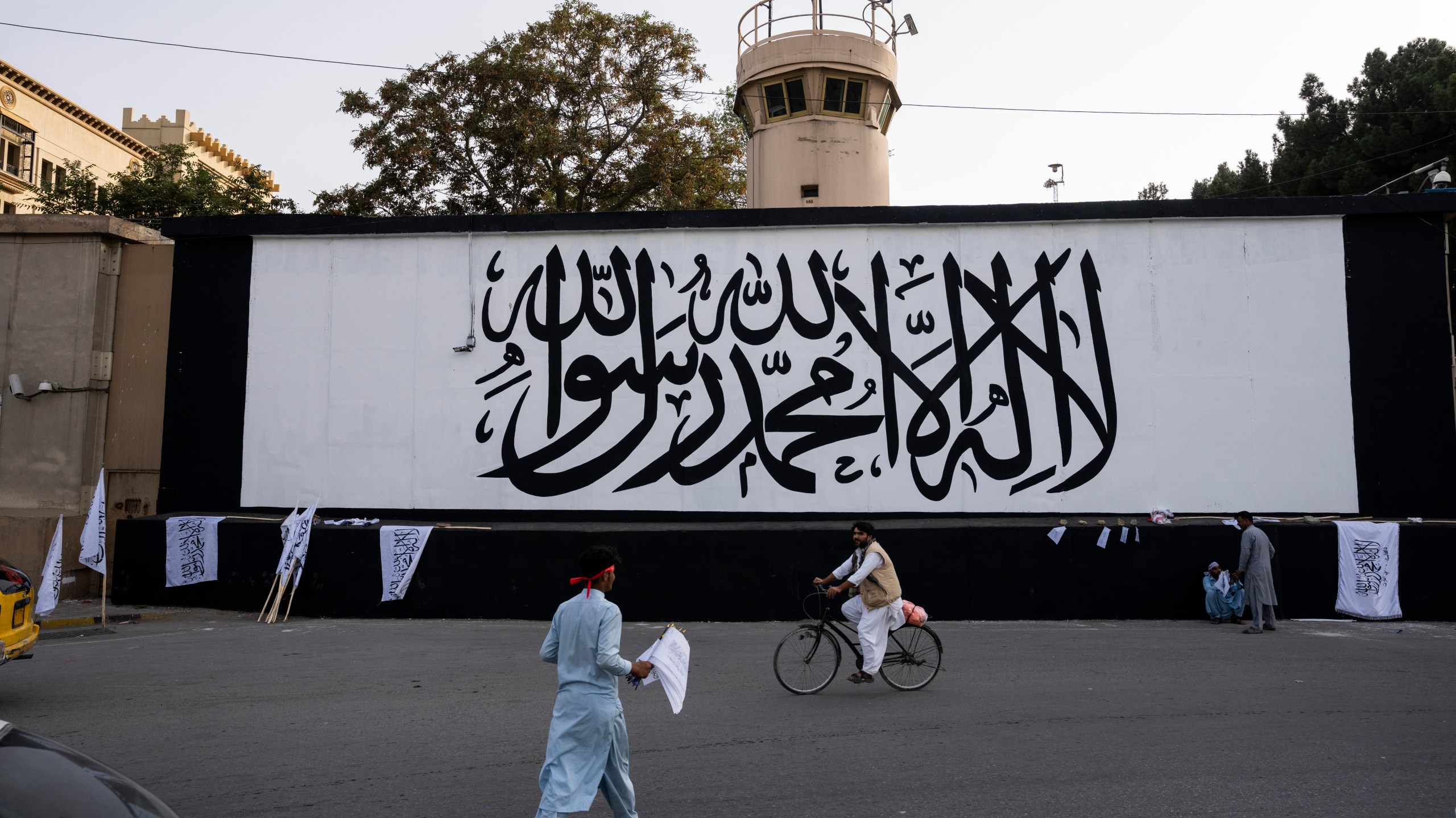 The iconic Taliban flag is painted on a wall outside the American embassy compound in Kabul, Afghanistan, Saturday, Sept. 11, 2021. (AP Photo/Bernat Armangue)