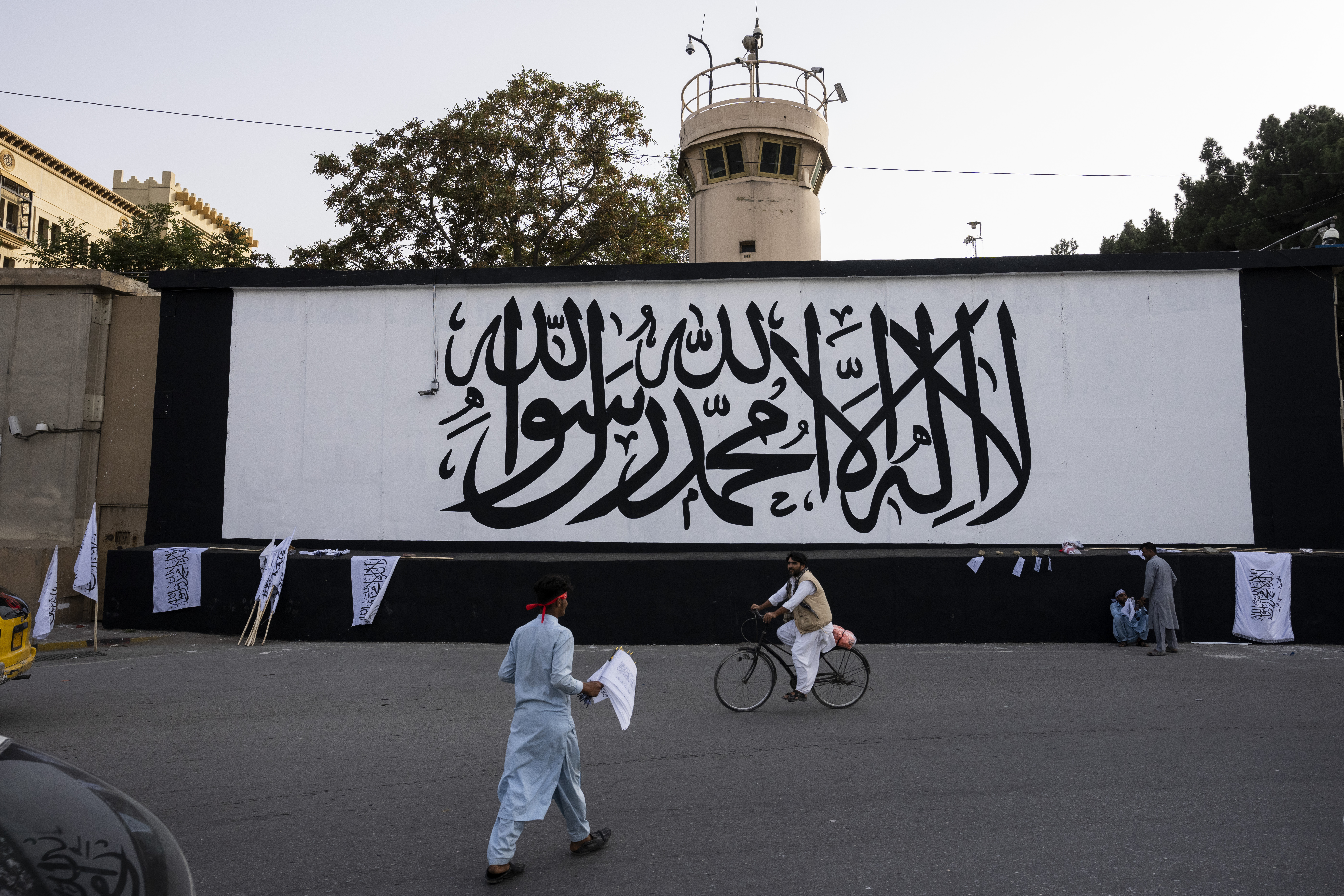 The iconic Taliban flag is painted on a wall outside the American embassy compound in Kabul, Afghanistan, Saturday, Sept. 11, 2021. (AP Photo/Bernat Armangue)