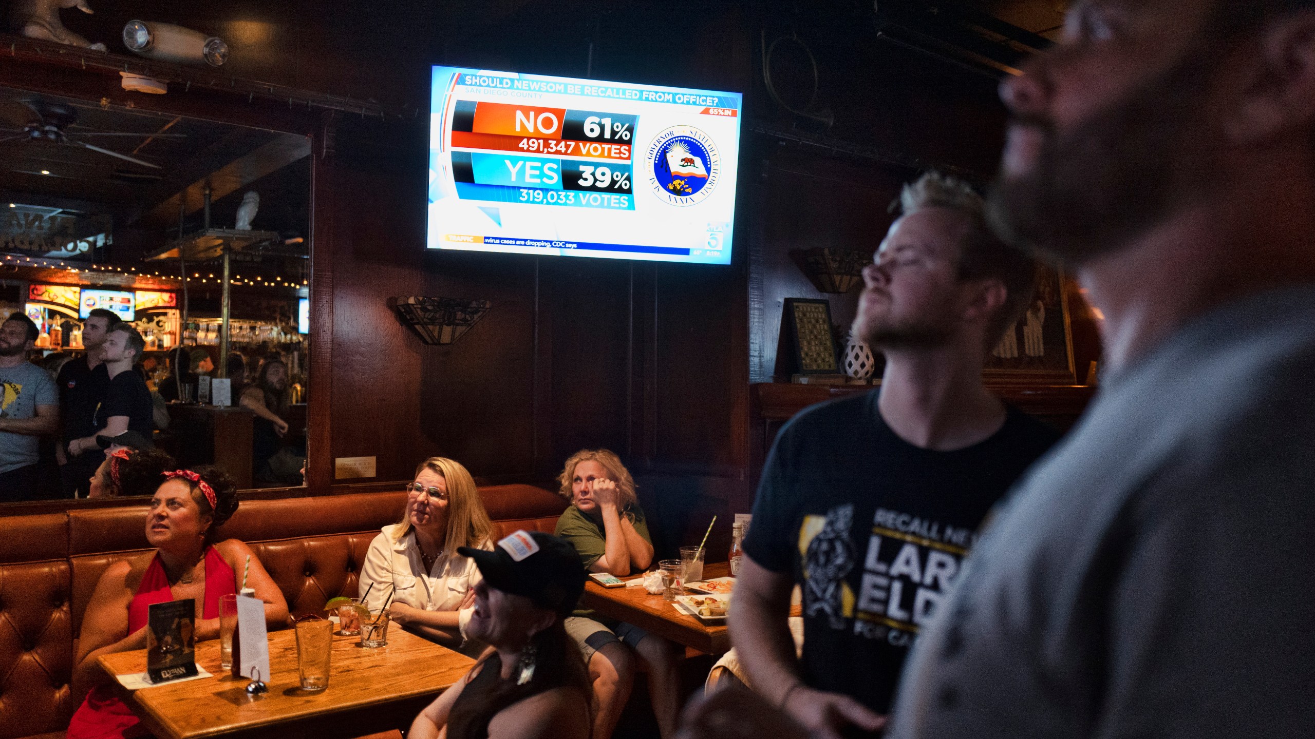 A group of pro-recall voters gather to watch early results of the California recall election during a party at the Pineapple Hill Saloon & Grill in Los Angeles on Sept. 14, 2021. (Richard Vogel / Associated Press)