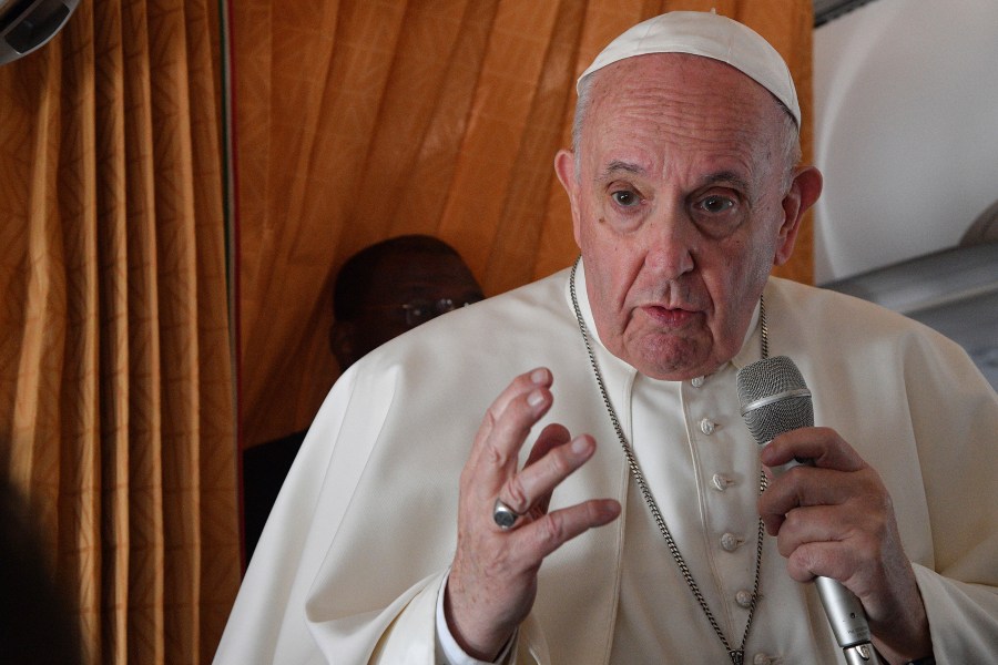 Pope Francis speaks with journalists on board an Alitalia aircraft enroute from Bratislava back to Rome on Sept. 15, 2021 after a four-day pilgrimage to Hungary and Slovakia. (Tiziana Fabi, Pool via Associated Press)