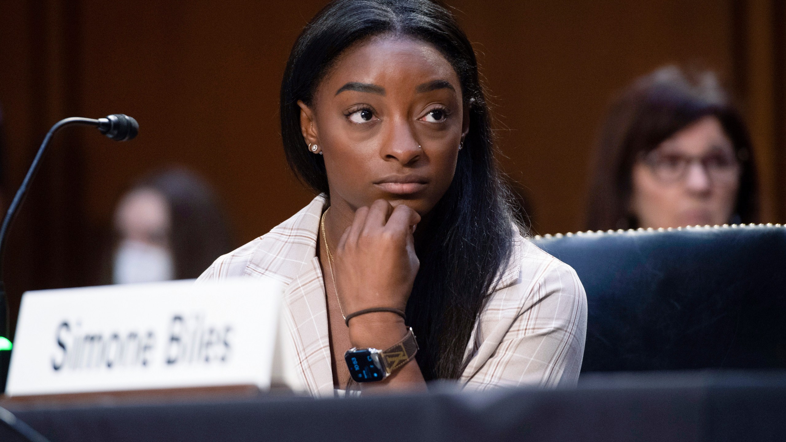 United States Olympic gymnast Simone Biles testifies during a Senate Judiciary hearing about the Inspector General's report on the FBI's handling of the Larry Nassar investigation on Capitol Hill, Wednesday, Sept. 15, 2021, in Washington. Nassar was charged in 2016 with federal child pornography offenses and sexual abuse charges in Michigan. He is now serving decades in prison after hundreds of girls and women said he sexually abused them under the guise of medical treatment when he worked for Michigan State and Indiana-based USA Gymnastics, which trains Olympians. (Saul Loeb/Pool via AP)