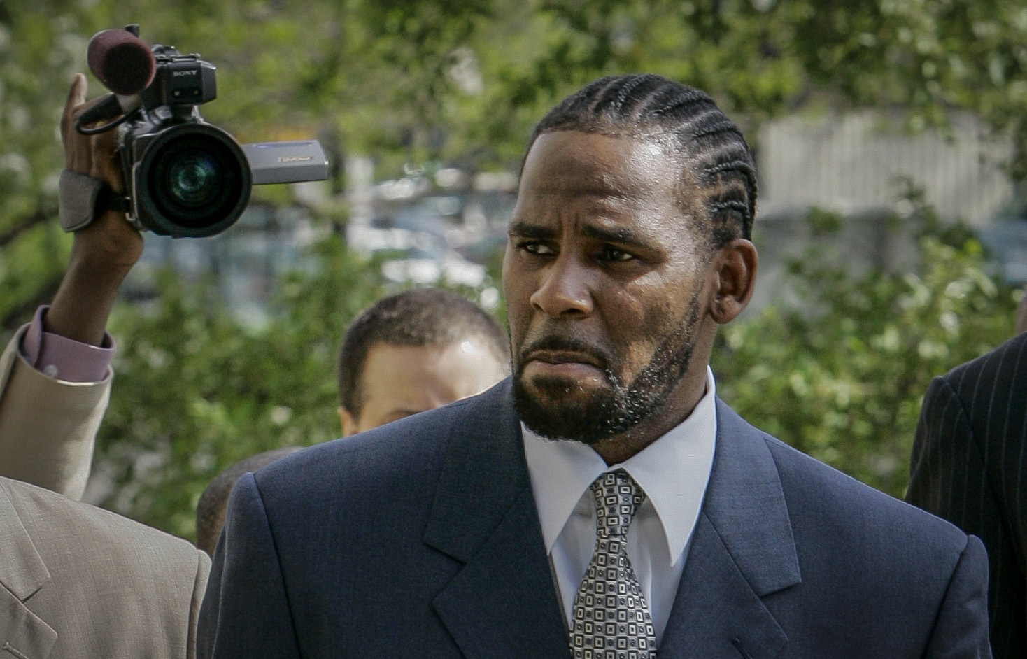 This photo from Friday May 9, 2008, shows R. Kelly arriving for the first day of jury selection in his child pornography trial at the Cook County Criminal Courthouse in Chicago. On Wednesday, Sept. 15, 2021, prosecutors in Kelly's sex trafficking trial at Brooklyn Federal Court in New York, played video and audio recordings for the jury they say back up allegations he abused women and girls. (AP Photo/Charles Rex Arbogast, File)