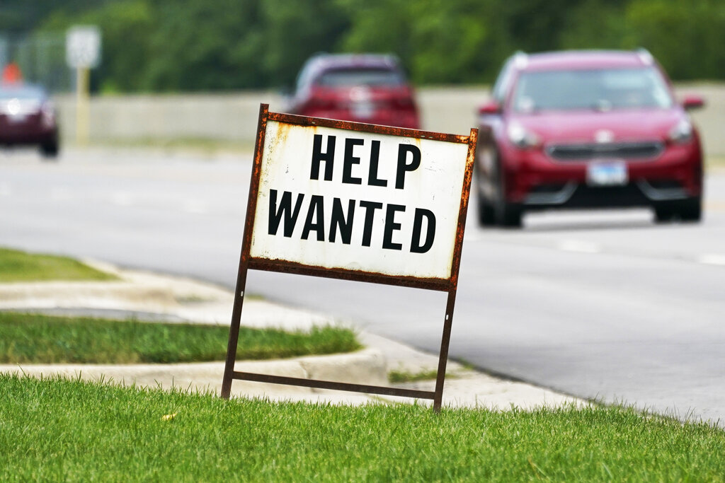 In this Tuesday, July 27, 2021, file photo, a help-wanted sign is displayed at a gas station in Mount Prospect, Ill. (AP Photo/Nam Y. Huh, File)