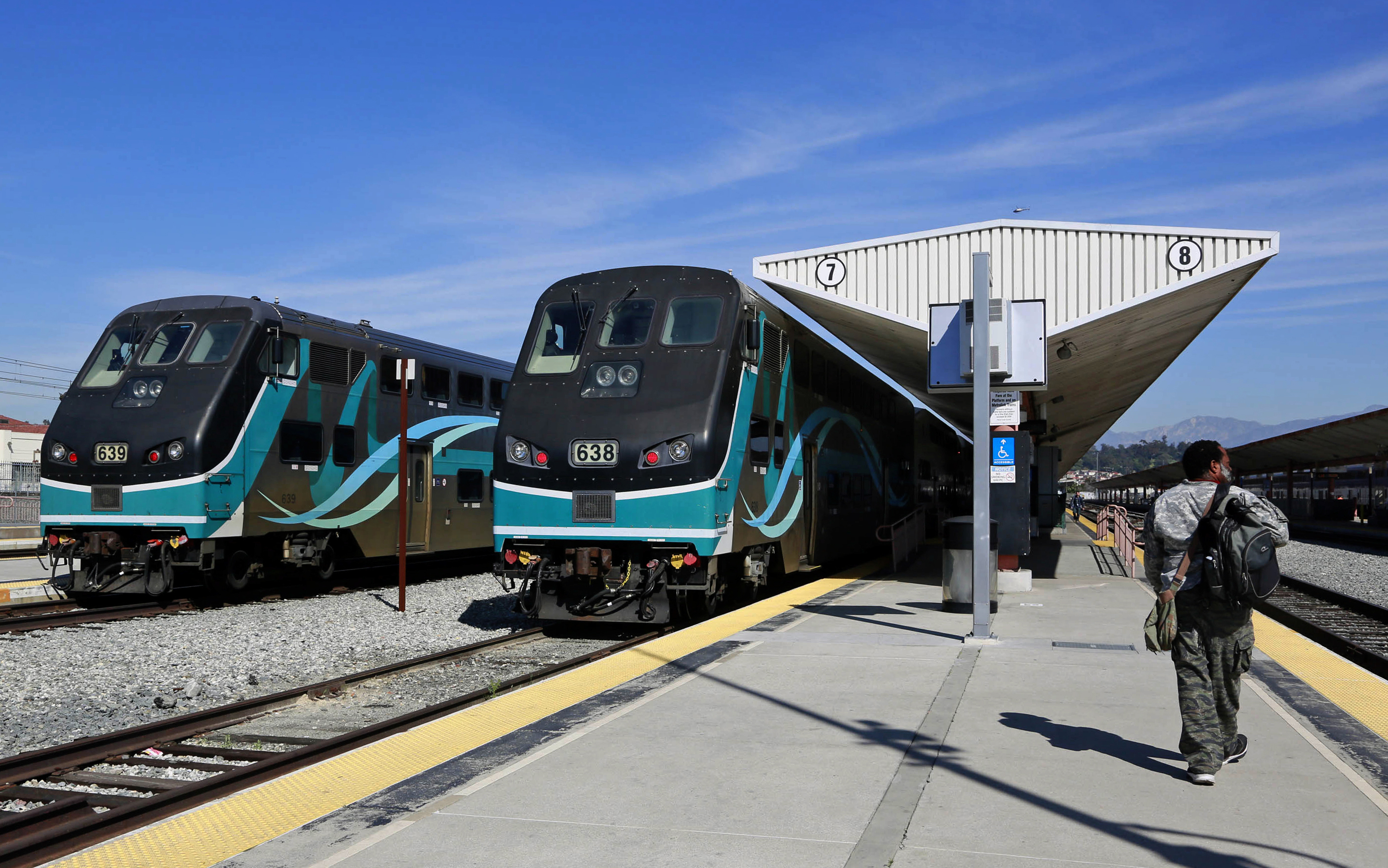 In this Feb. 25, 2015, file photo, Metrolink commuter trains stand at a platform at Union Station in downtown Los Angeles. (AP Photo/Nick Ut, File)