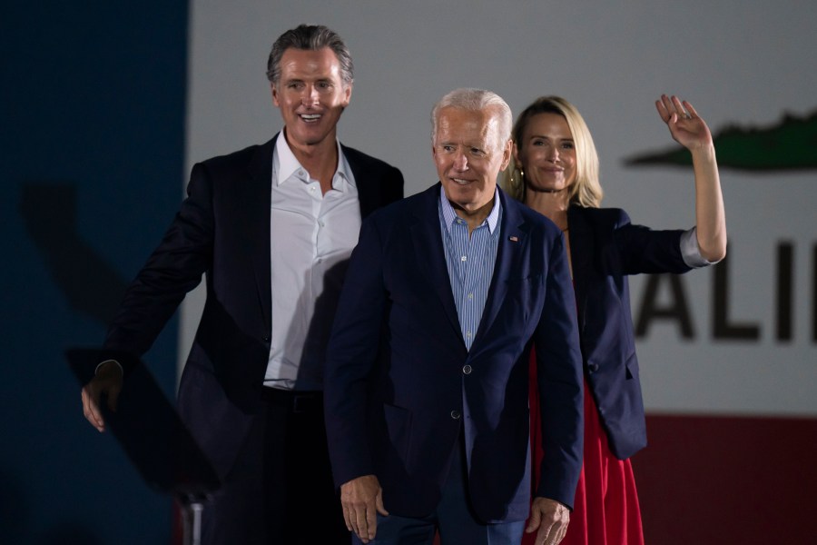 In this Sept. 13, 2021, file photo President Joe Biden, center, smiles to the crowd as he is flanked by California Gov. Gavin Newsom and Jennifer Siebel Newsom at a rally ahead of the California gubernatorial recall election in Long Beach, Calif. (AP Photo/Jae C. Hong, File)