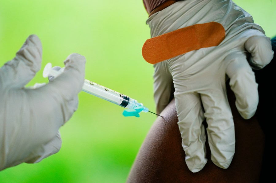 In this Sept. 14, 2021, file photo, a health worker administers a dose of a Pfizer COVID-19 vaccine during a vaccination clinic at the Reading Area Community College in Reading, Pa. (AP Photo/Matt Rourke, File)