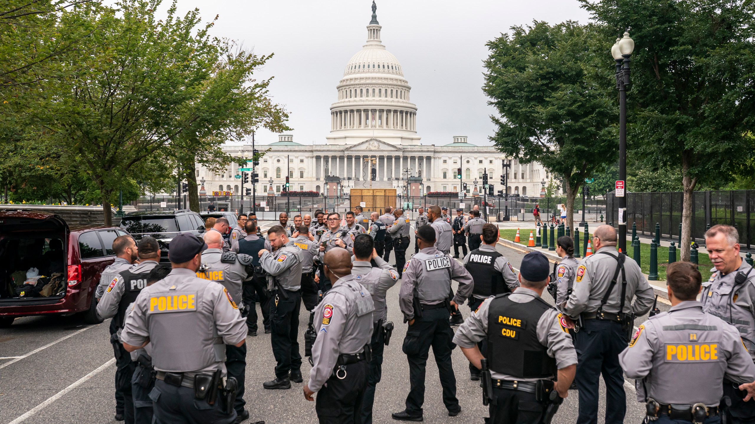 Police stage at a security fence ahead of a rally near the U.S. Capitol in Washington, Saturday, Sept. 18, 2021. (AP Photo/Nathan Howard)