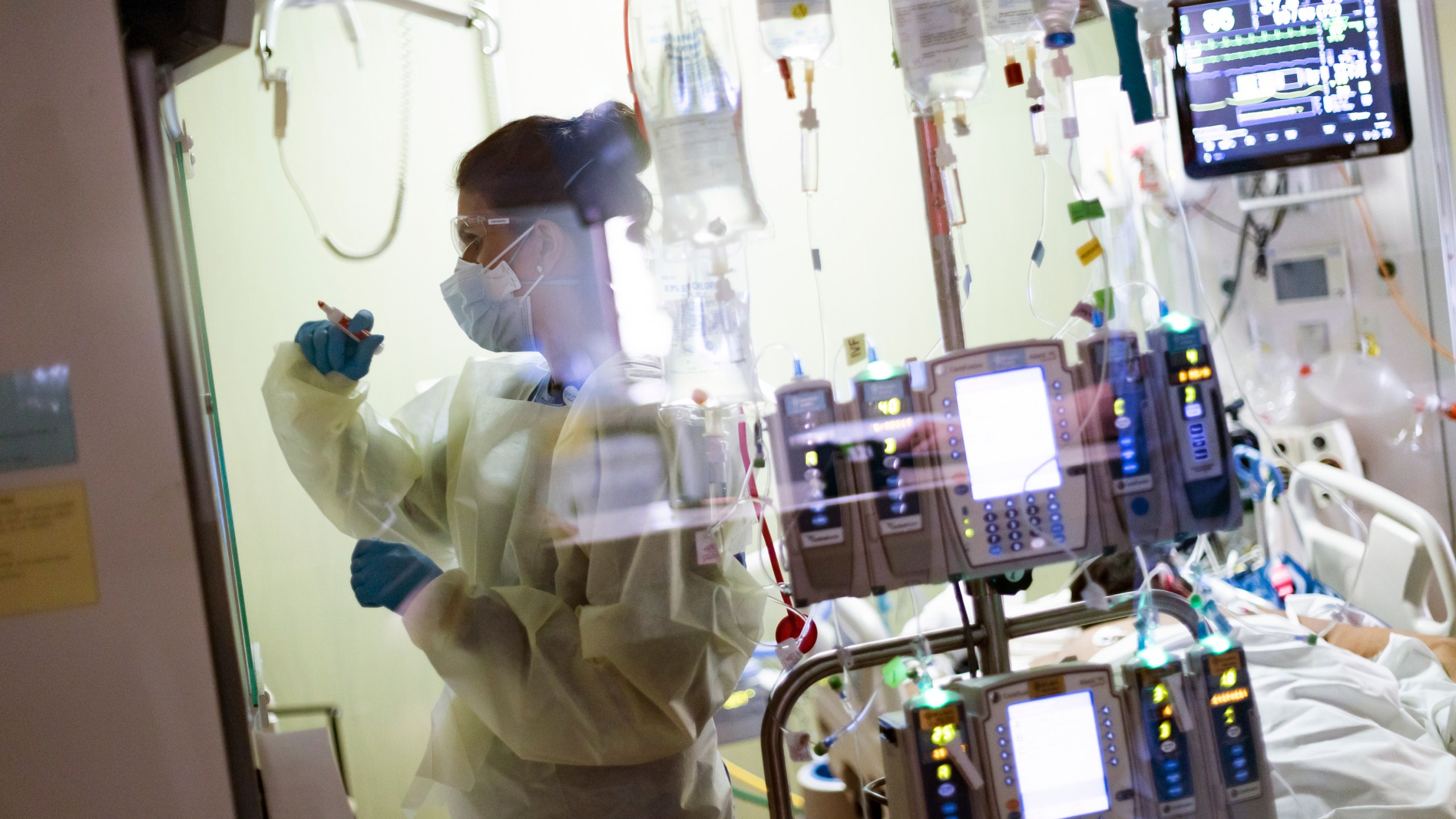 In this Aug. 31, 2021, file photo, Ann Enderle R.N. attends to a COVID-19 patient in the Medical Intensive care unit (MICU) at St. Luke's Boise Medical Center in Boise, Idaho. (AP Photo/Kyle Green, File)