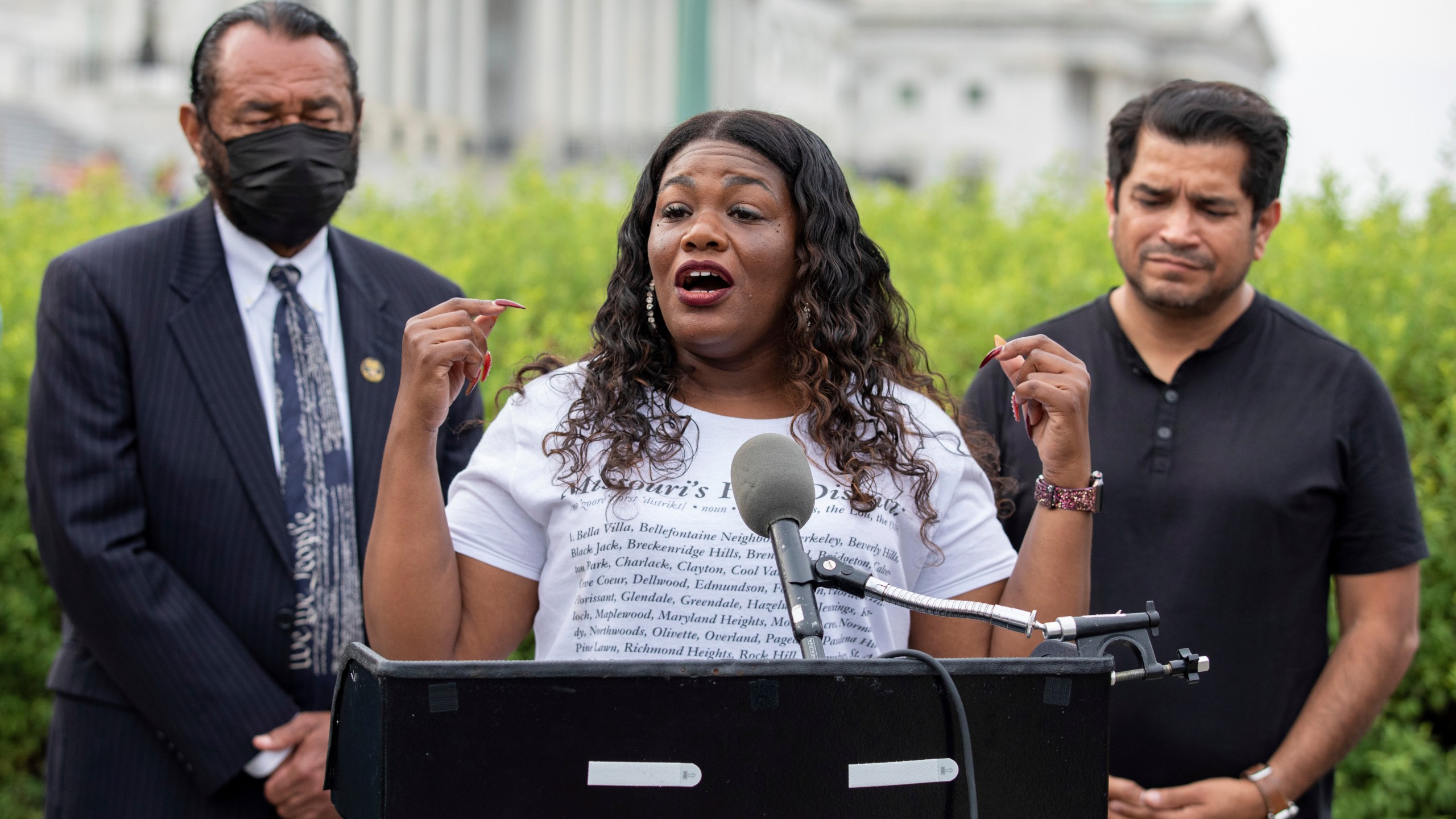 In this Aug. 3, 2021, file photo Rep. Cori Bush, D-Mo., flanked by Rep. Al Green, D-Texas, left, and Rep. Jimmy Gomez, D-Calif., right, speaks to the press after it was announced that the Biden administration will enact a targeted nationwide eviction moratorium outside of Capitol Hill in Washington. Several progressive lawmakers, including Bush, on Tuesday, Sept. 21, introduced a bill that would reimpose a nationwide eviction moratorium at a time when deaths from COVID-19 are running at their highest levels since early March. (AP Photo/Amanda Andrade-Rhoades, File)