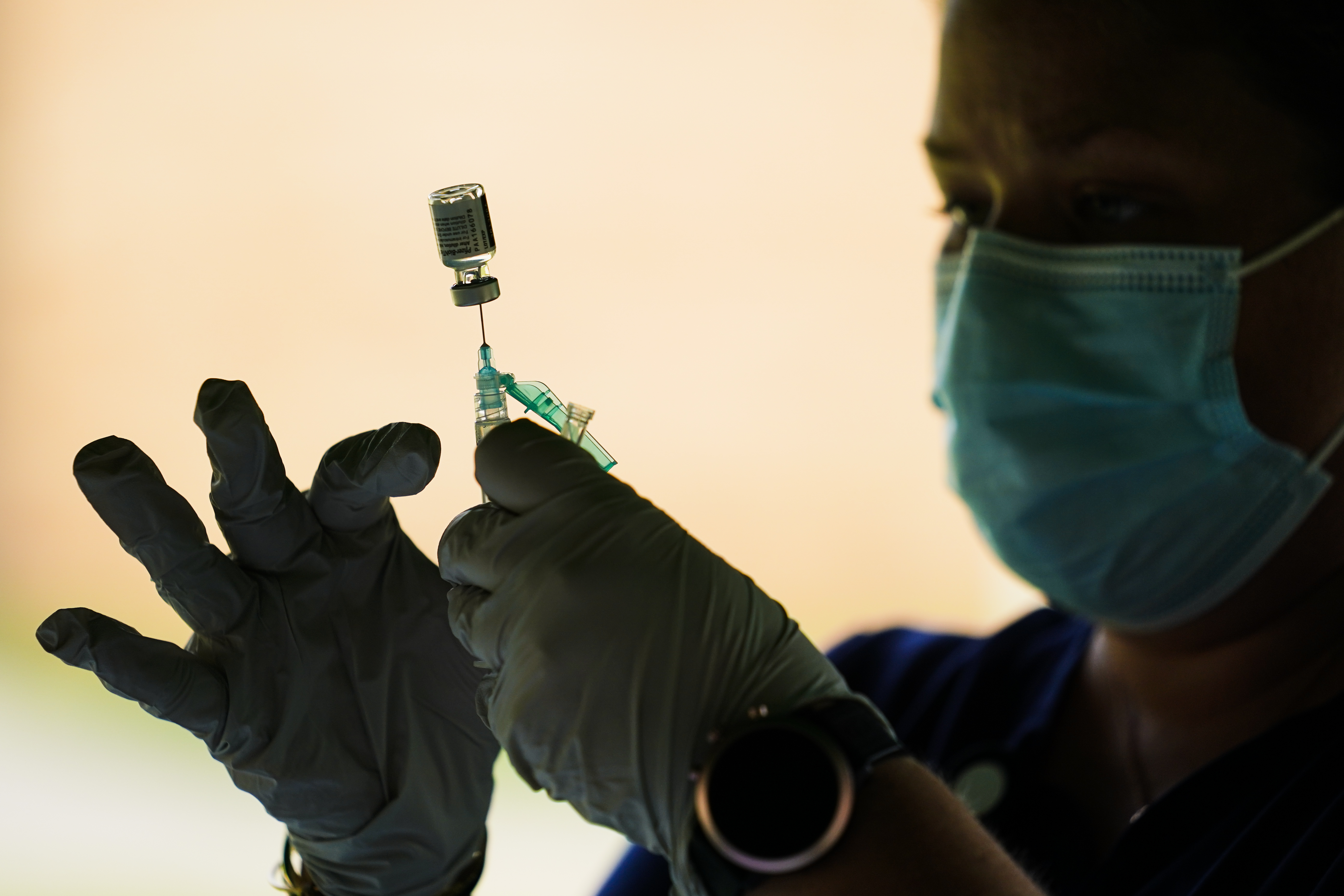 In this Sept. 14, 2021, file photo, a syringe is prepared with the Pfizer COVID-19 vaccine in Reading, Pa. (AP Photo/Matt Rourke)