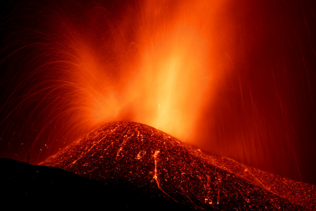 Lava from a volcano eruption flows on the island of La Palma in the Canaries, Spain, Thursday, Sept. 23, 2021. (AP Photo/Emilio Morenatti)