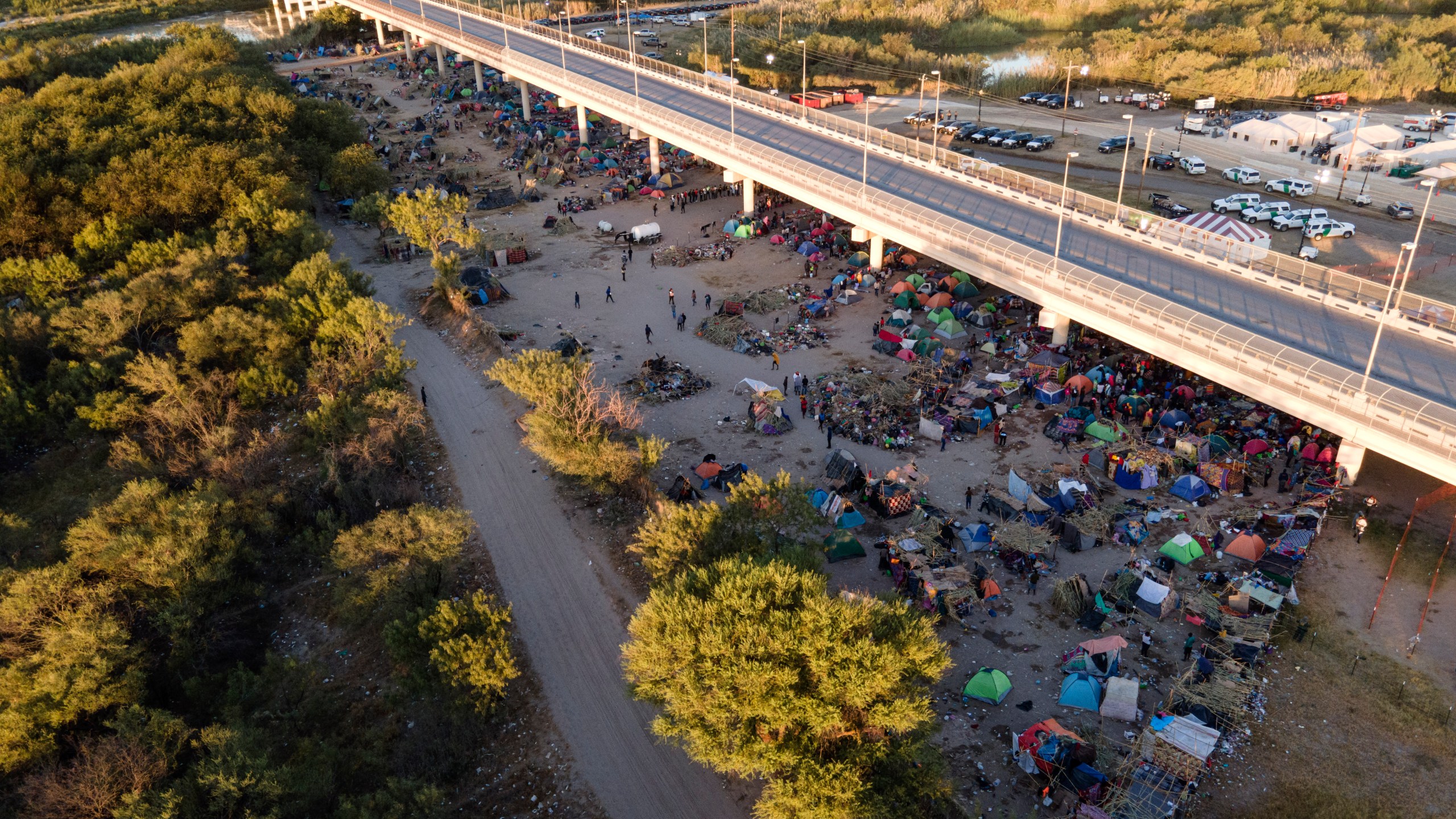 Migrants, many from Haiti, are seen in an encampment along the Del Rio International Bridge near the Rio Grande on Sept. 23, 2021.(Julio Cortez/Associated Press)