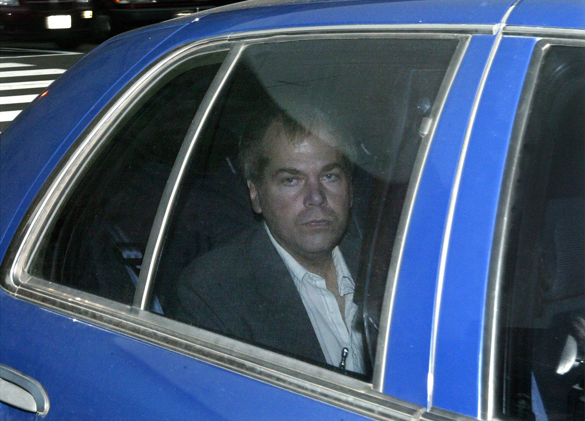 In this Nov. 18, 2003, file photo, John Hinckley Jr. arrives at U.S. District Court in Washington. Lawyers for Hinckley, the man who tried to assassinate President Ronald Reagan, are scheduled to argue in court Monday, Sept. 27, 2021, that the 66-year-old should be freed from restrictions placed on him after he moved out of a Washington hospital in 2016. (AP Photo/Evan Vucci, File)