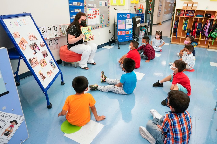 In this Sept. 16, 2021, file photo Pre-K teacher Vera Csizmadia teaches 3-and 4-year-old students in her classroom at the Dr. Charles Smith Early Childhood Center in Palisades Park, N.J. As Democrats push ahead with President Joe Biden’s $3.5 trillion rebuilding plan, they are promising historic investments across all levels of education. The proposal includes universal prekindergarten, two years of free community college and expanded child care subsidies, among others. (AP Photo/Mary Altaffer, File)