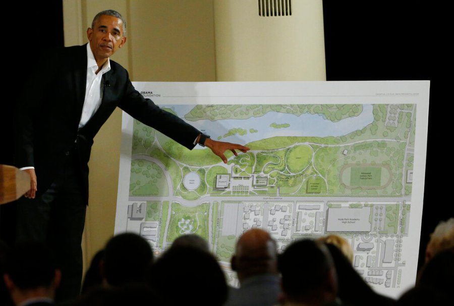 In this May 3, 2017, file photo, former President Barack Obama points to a rendering for the former president's lakefront presidential center at a community event at the South Shore Cultural Center in Chicago. (AP Photo/Nam Y. Huh, File)