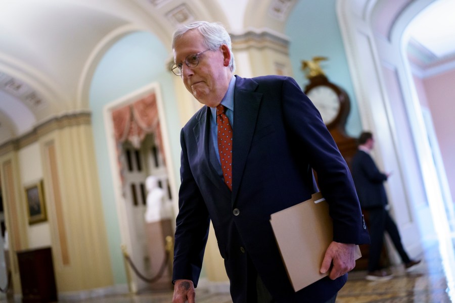 Senate Minority Leader Mitch McConnell, R-Ky., walks to the chamber for a test vote on a government spending bill at the Capitol in Washington on Sept. 27, 2021. (J. Scott Applewhite / Associated Press)