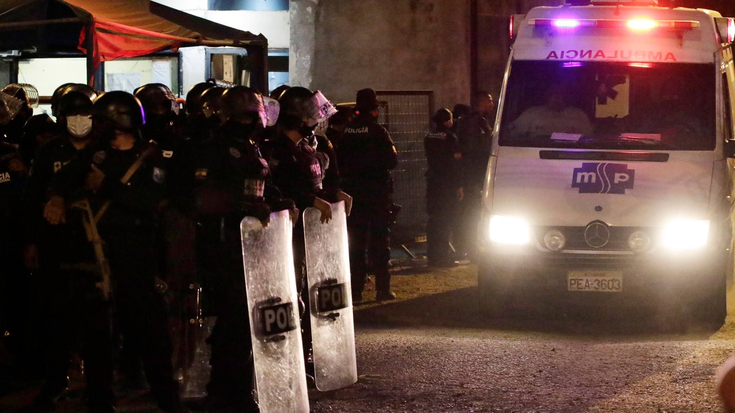 An ambulance leaves from the Litoral penitentiary after a riot, in Guayaquil, Ecuador on Sept. 28, 2021. (AP Photo/Angel DeJesus)