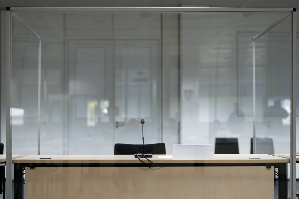 The seat of the accused is empty at the courtroom prior to a trial against a 96-year-old former secretary for the SS commander of the Stutthof concentration camp at the court in Itzehoe, Germany, Thursday, Sept. 30, 2021. (AP Photo/Markus Schreiber, Pool)