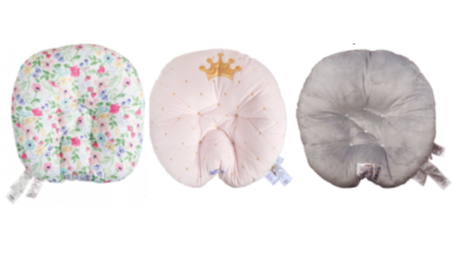 The Boppy Original Newborn Lounger (left), Boppy Preferred Newborn Lounger (center), and Pottery Barn Kids Boppy Newborn Lounger (right) are seen in an image provided by the U.S. Consumer Product Safety Commission on Sept. 23, 2021.