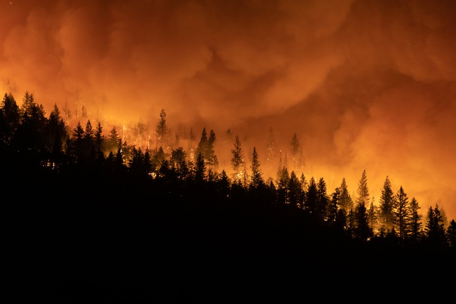 The Dixie Fire burns on a mountain ridge sending embers into the air on Aug. 5, 2021 in Greenville. (Trevor Bexon/Getty Images)