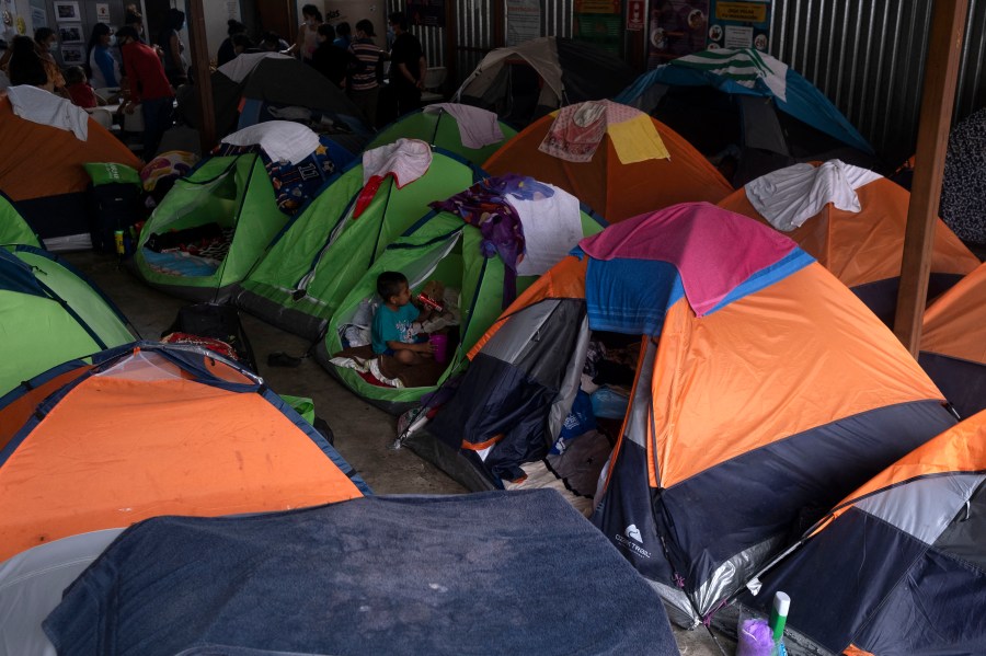 Asylum seekers and migrants are seen at a shelter in Tijuana, Baja Caifornia state, on Aug. 20, 2021. (Guillermo Arias / AFP / Getty Images)