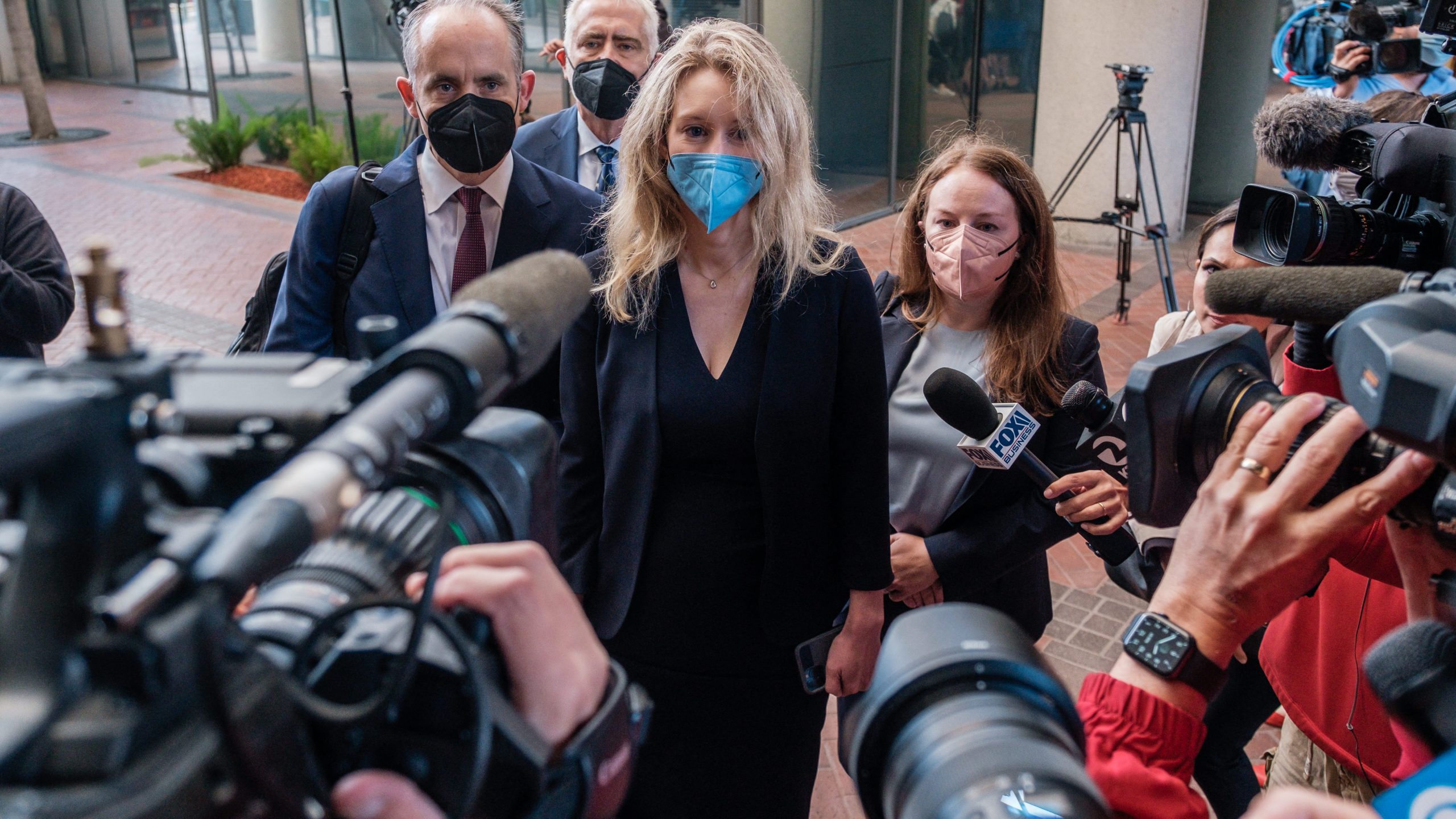 Elizabeth Holmes, the founder and former CEO of blood testing and life sciences company Theranos, arrives for the first day of jury selection in her fraud trial, outside Federal Court in San Jose, California, on Aug. 31, 2021. (NICK OTTO/AFP via Getty Images)